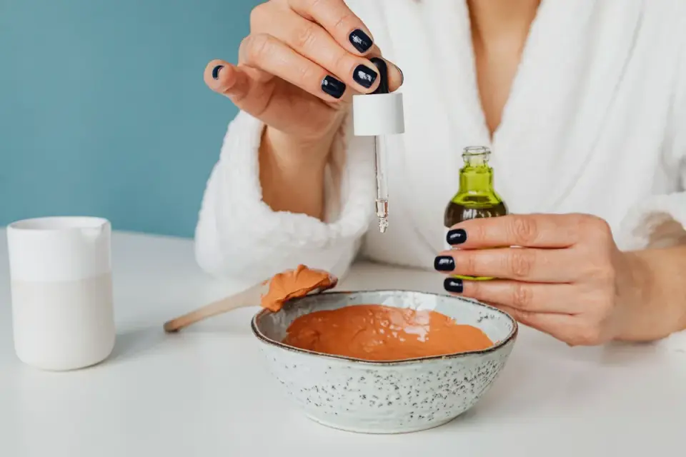A dropper bottle of calming supplement beside a dog&#x27;s food bowl
