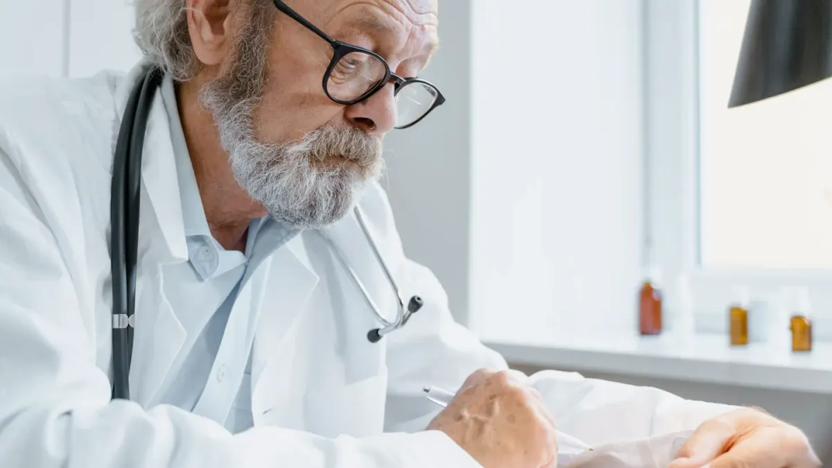 A veterinarian examining a dog supplement label next to a senior dog on an exam table