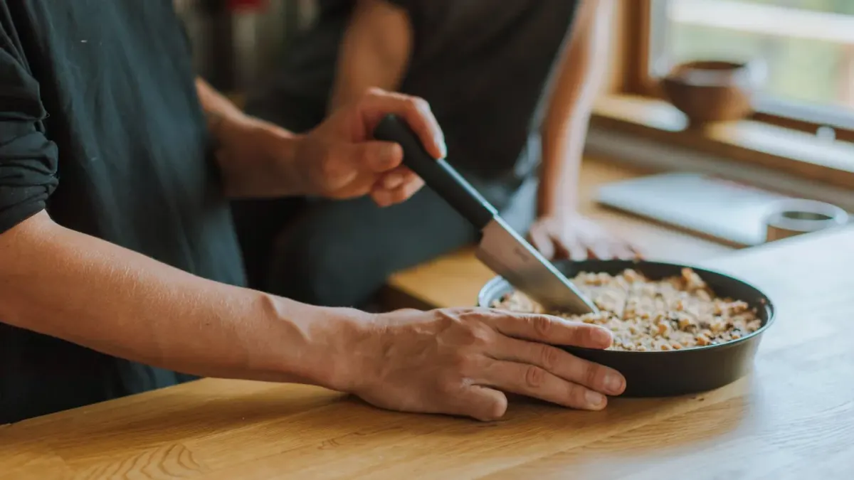 Dog owner preparing a meal