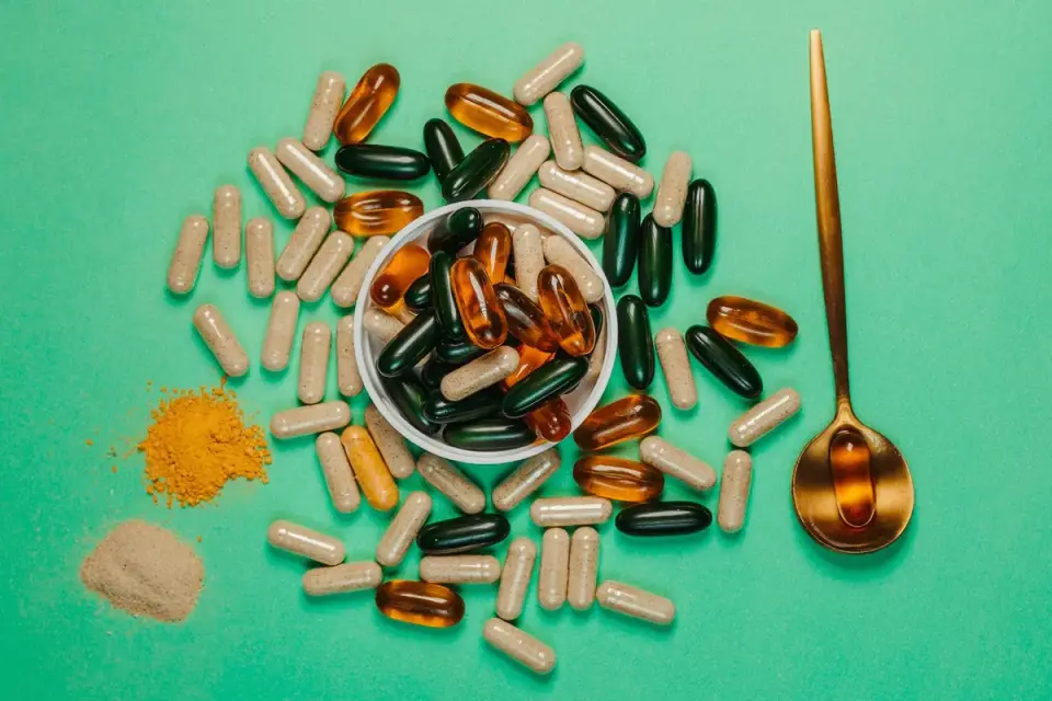 Joint supplement soft chews and capsules arranged on a wood table