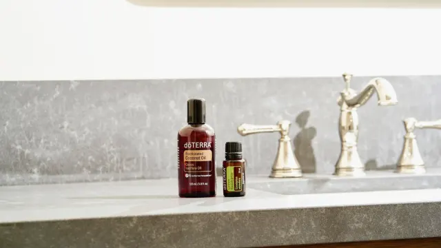 Senior golden retriever standing next to a bowl and a pump-top fish oil supplement bottle
